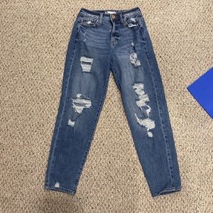 Juniors mom jeans size 0/24W. High rise fit with rips on both legs. Medium wash.